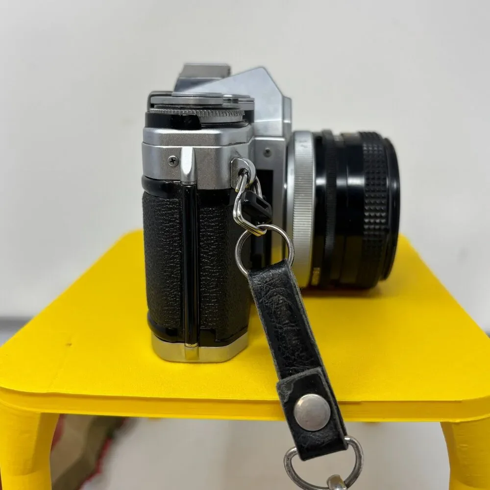 Canon AE-1 35mm SLR Film Camera W/ 2 Lens, Flash, Case, Paperwork UNTESTED